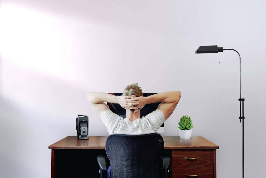 A person focused on creative work in a bright workspace